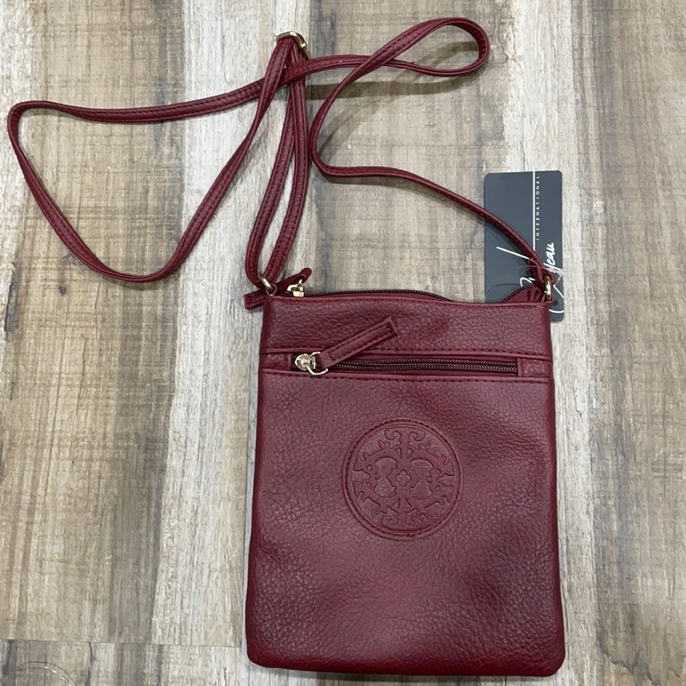 Burgundy crossbody bag , never used